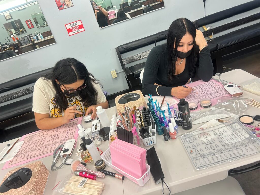 five star academy cosmetology apprentices practicing nails